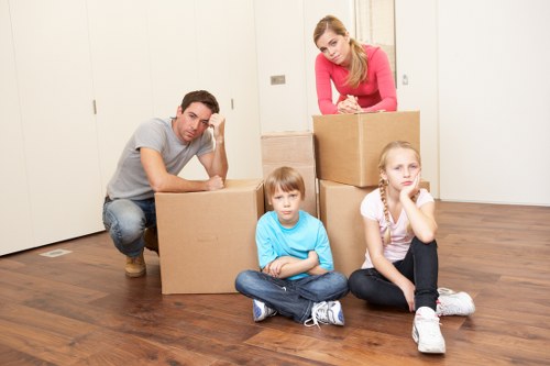 Professional movers loading furniture into a removal van in Tooting