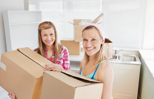 Local moving team with boxes and furniture for Tooting customers