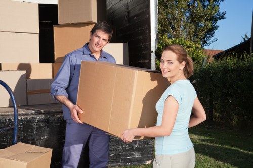 Furniture and boxes being loaded into a moving truck