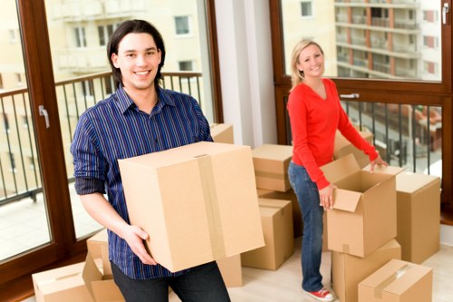 Packed moving boxes and furniture ready for local removal service